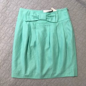 NWT Plastic Island Linen skirt with bow detail.